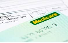 A Medicare card on top of a medical bill. Contributor: Michael Willis / Alamy Stock Photo Image ID: B394RC